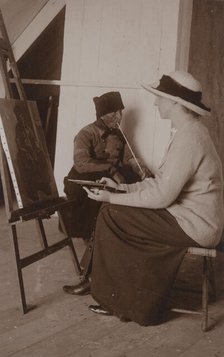 Maud Sherwood painting a dutchman with a clay pipe, 1913. Creator: Unknown.