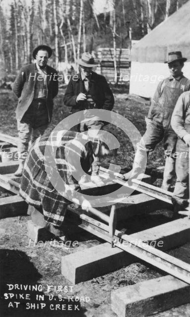Babe White driving first spike in U.S. Railroad, between c1900 and c1930. Creator: Unknown.