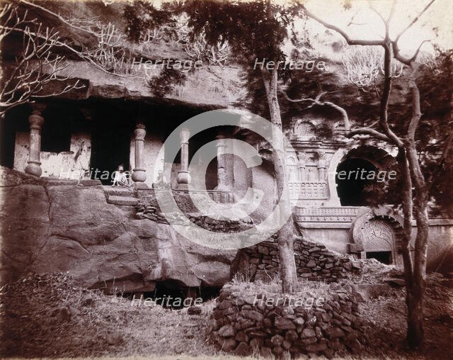 Two men sitting in a temple carved out of a rock face in Bombay at the time of the plague, 1896/1897 Creator: Unknown.