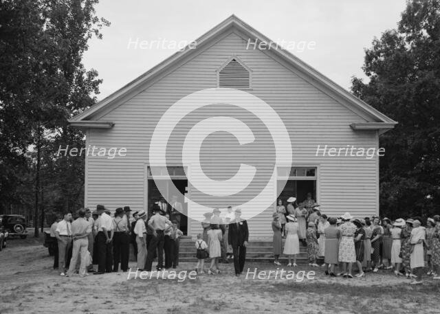 Congregation gathers in groups...Wheeley's Church, Person County, North Carolina, 1939. Creator: Dorothea Lange.