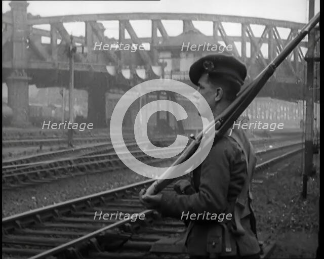 A Male Armed Soldier Guarding Railway Lines, 1926. Creator: British Pathe Ltd.
