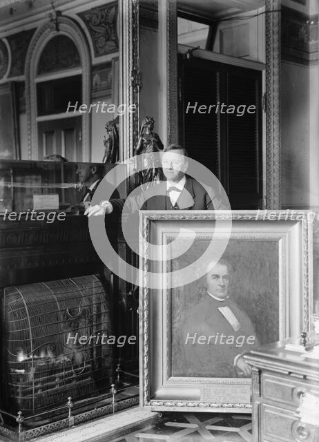 Daniels, Josephus, Secretary of The Navy, 1913-1921. with Painting of Secretary of The Navy..., 1913 Creator: Harris & Ewing.