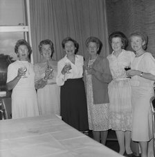 Women with celebratory drinks at the retirement presentation of Mary Coldicott
, 01/08/1986. Creator: John Laing plc.