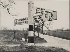 Finger post road sign on the A600 between Bedford and Shefford, Southill, 1940-1960. Creator: George R Long.