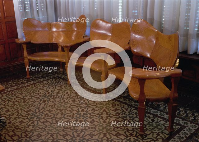 Wood sofa in the dining room of the Casa Batllo, 1904-1906, designed by Antoni Gaudi.