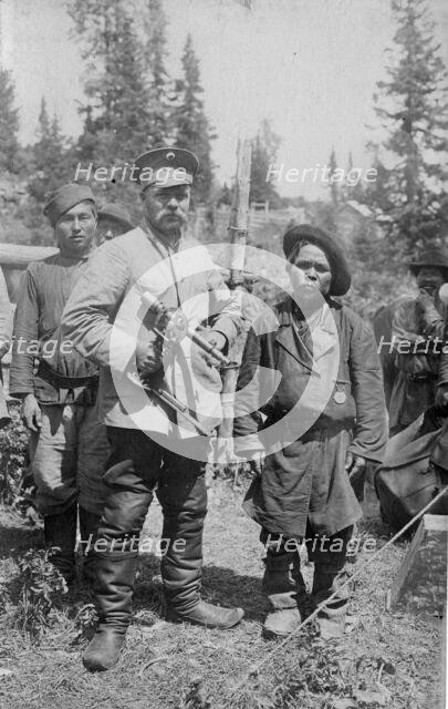 Topographer, a Member of the Land-Management Expedition with the Village Headman, 1913. Creator: GI Ivanov.