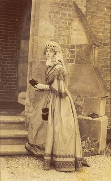 A man in drag posing in historical costume, (between 1890 and 1899?). Creator: Unknown.