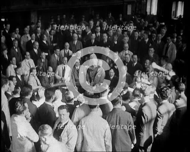 Crowd of Civilians Buying and Selling Stocks and Shares, 1932. Creator: British Pathe Ltd.