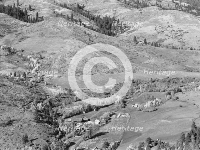 Looking down on Ola self-help co-op mill showing the upper end of Squaw..., Gem County, Idaho, 1939. Creator: Dorothea Lange.