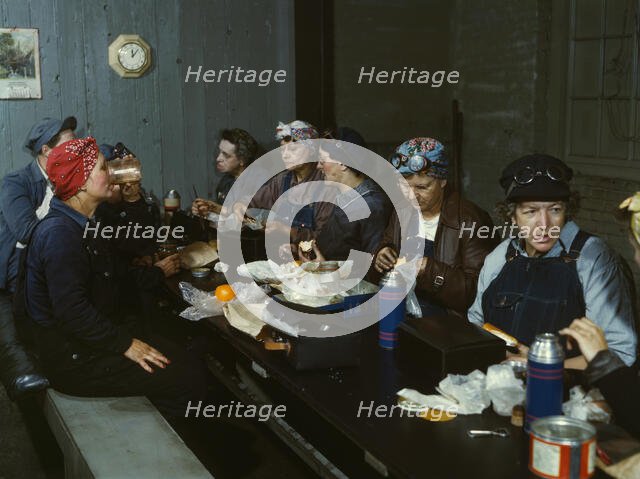 Women workers employed as wipers in the roundhouse having lunch..., C&NWRR., Clinton, Iowa, 1943. Creator: Jack Delano.