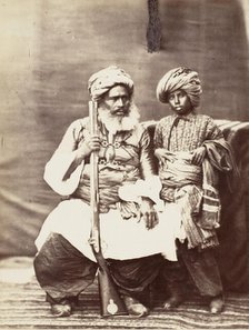 Turbaned Man Holding Rifle with Boy Alongside, 1860s. Creator: Unknown.