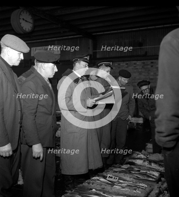 Wholesalers and fishmongers at the fish auction, Gothenburg, Sweden, 1960. Artist: Torkel Lindeberg