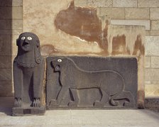 Basalt sphinx and a lion in relief, guarding the Temple of Tell Halaf, c6100 to 5400 BC. Creator: Unknown.