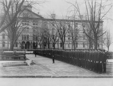 U.S. Naval Academy, Annapolis Md.: cadets lined up in row leading to building, (1902?). Creator: Frances Benjamin Johnston.