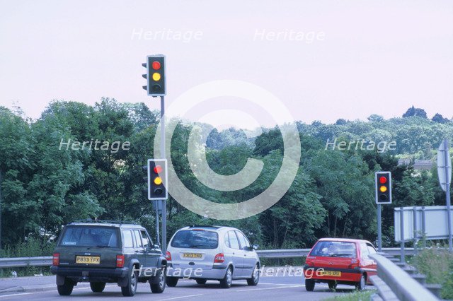 Traffic stopped at Traffic lights. Artist: Unknown.