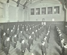 Boys lined up in the assembly hall, Beaufoy Institute, London, 1911. Artist: Unknown.