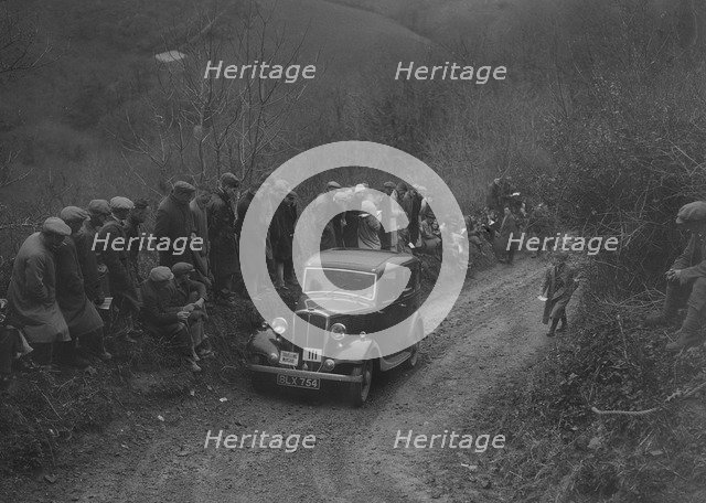 Standard saloon of GH Strong competing in the MCC Lands End Trial, 1935. Artist: Bill Brunell.