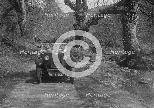 Kitty Brunell road testing a Riley 9 WD tourer, c1930. Artist: Bill Brunell.