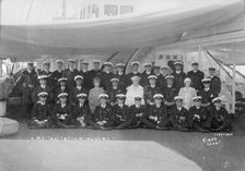 King George V and Queen Mary aboard 'HMY Victoria and Albert', with her crew, c1933. Creator: Kirk & Sons of Cowes.