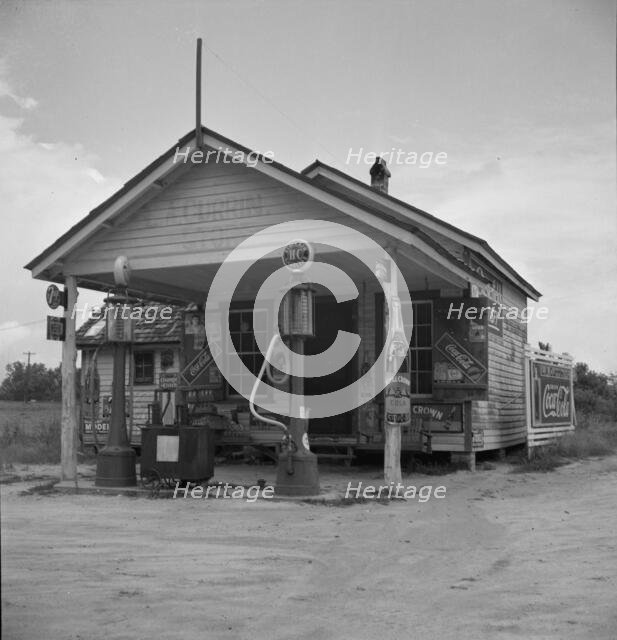 Country filling station owned and operated by tobacco farmer, Granville County, North Carolina, 1939 Creator: Dorothea Lange.