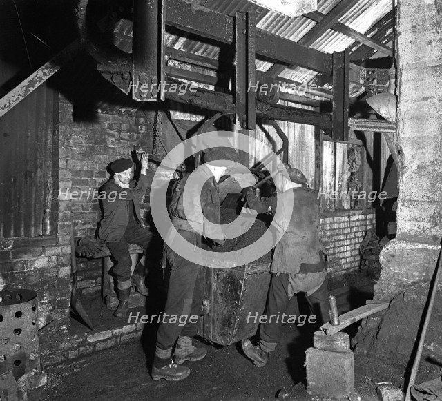 Miners working in Mitchell Main Colliery near Barnsley, South Yorkshire, 1956. Artist: Michael Walters