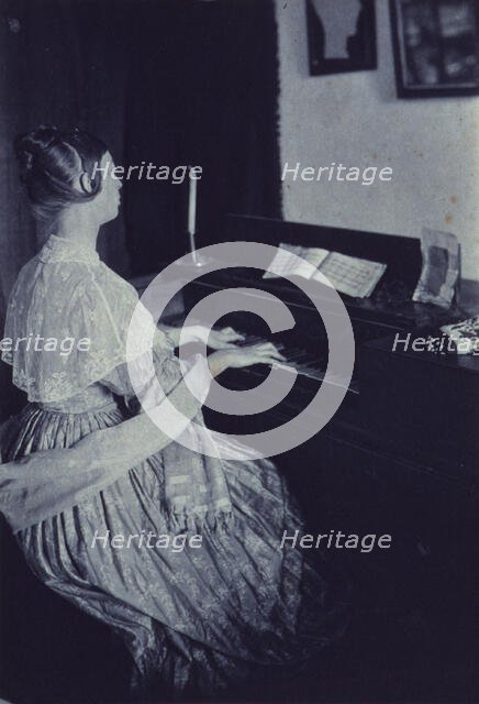 At the spinet, c1900. Creator: Frances S. Allen.