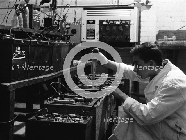 A young apprentice at Globe & Simpson auto electricians workshop, Lincoln, Lincolnshire, 1961. Artist: Michael Walters
