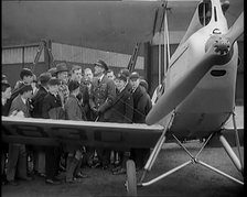 A Group of Male Children Standing Next To an RAF Officer and an Aeroplane, 1931. Creator: British Pathe Ltd.