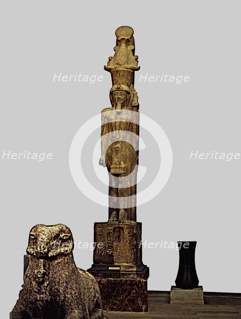 Colossal statue of Sethi II carrying a divine emblem, made in sandstone, from the Temple of Amon …