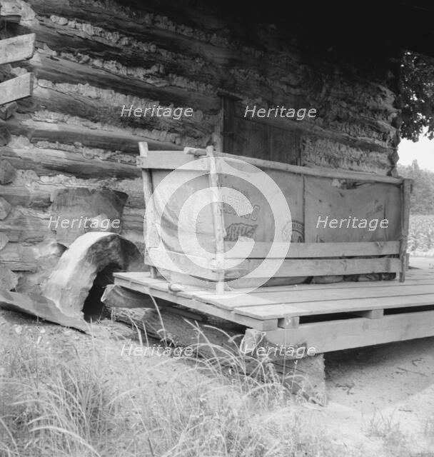 Tobacco barn with tobacco sled and vehicle used..., Person County, North Carolina, 1939. Creator: Dorothea Lange.