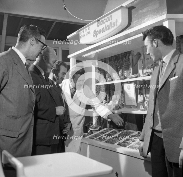 Butcher from Danish Bacon giving a demonstration, Kilnhurst, South Yorkshire, 1961.  Artist: Michael Walters