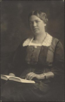 Portrait of a Woman with Open Book, 1907-1943. Creator: Louis Fleckenstein.