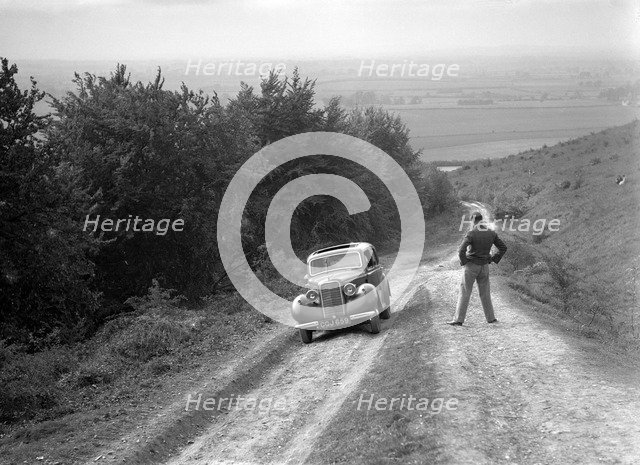 1935 Hillman Minx 1185 cc competing in a Talbot CC trial. Artist: Bill Brunell.