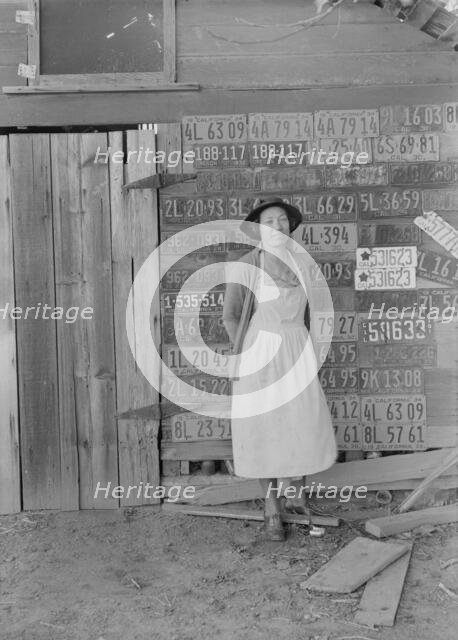 Farm woman beside her barn door,  Tulare County, California, 1938. Creator: Dorothea Lange.