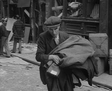 A Man Carrying His Possessions Away, 1940. Creator: British Pathe Ltd.