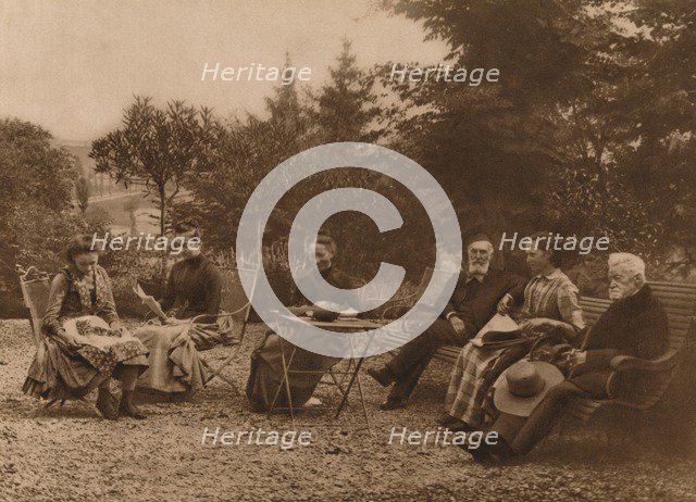 'A group of men and women sat talking by a table', 1937. Artist: Louis Guichard.