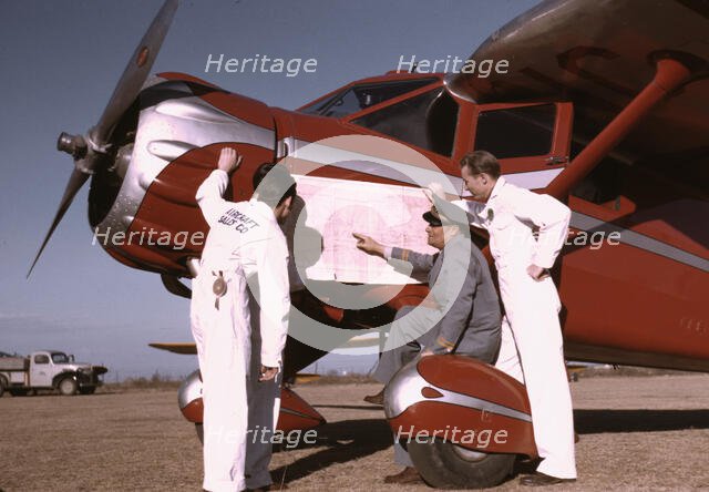 Instructor and students studying a map, Meacham Field, Fort Worth, Tex., 1942. Creator: Arthur Rothstein.