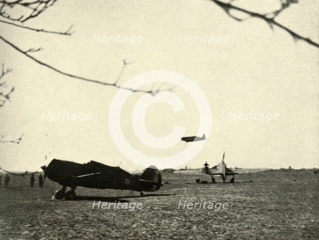 'Morane 406 at Vassincourt Aerodrome with French Curtiss Hawk and  Hurricane', 1939-1940, (1941). Creator: Unknown.