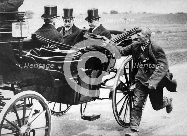 Beggar holidng out his cap as he passes King George V in a carriage, c1911-1936. Artist: Unknown