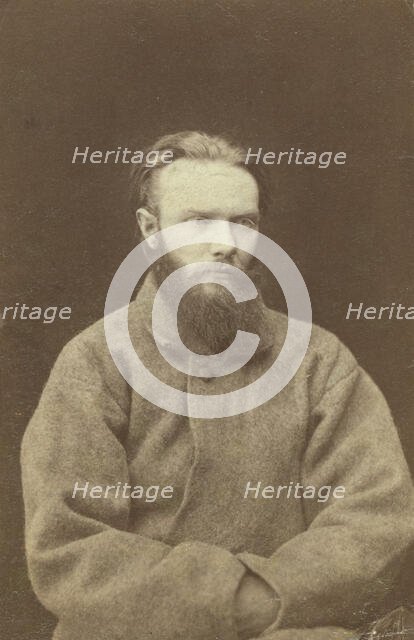 Shchedrin, one of four men chained to wheelbarrows at Kara, between 1880 and 1886. Creator: Unknown.