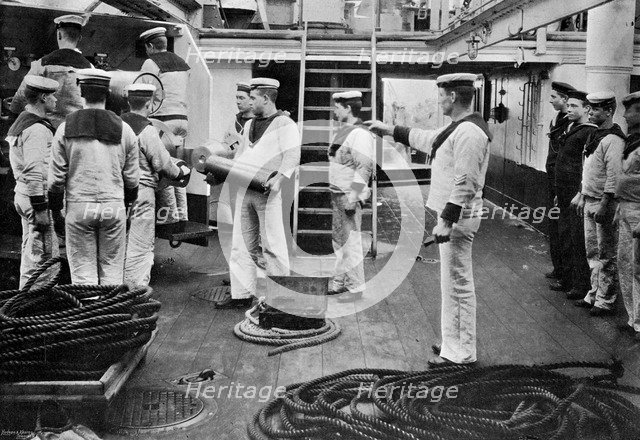 At drill with a 6 inch quick firing gun on board the battleship HMS 'Resolution', 1896.Artist: Gregory & Co