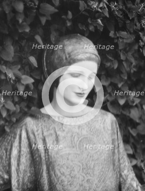 Person wearing a mask made by W.T. Benda, 1925 Sept. 20. Creator: Arnold Genthe.