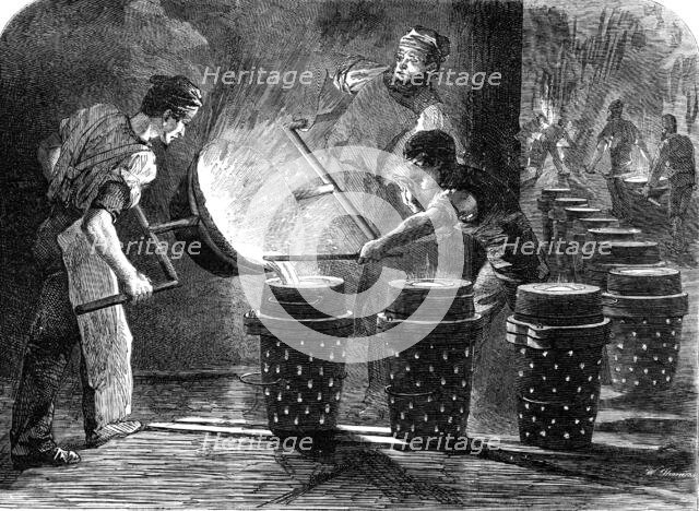 Manufacture of the Armstrong Gun at Woolwich Arsenal: casting the shot and shell for 100..., 1862. Creator: W Thomas.