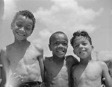 Three youngsters, Frederick Douglass housing project, Anacostia, D.C., 1942. Creator: Gordon Parks.