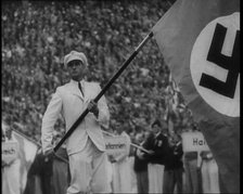 Man Holding the Flag of Nazi Germany, 1936. Creator: British Pathe Ltd.