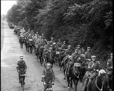 British Soldiers Riding Horses and Bikes on Salisbury Plain, 1933. Creator: British Pathe Ltd.