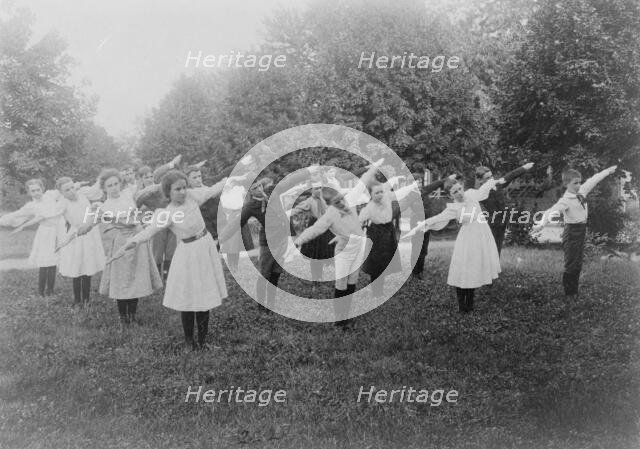 School children exercising on lawn, Washington, D.C., (1899?). Creator: Frances Benjamin Johnston.