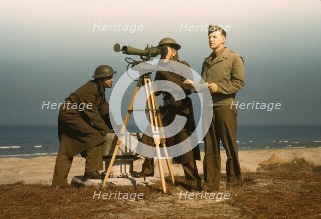 Men of Fort Story operate an azimuth instrument, to measure the angle..., Fort Story, Va., 1942. Creator: Alfred T Palmer.
