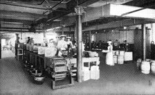 Where machinery is paramount: filling and weighing packages of lard, 1909. Creator: Unknown.