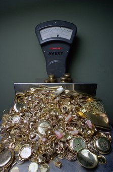 Weighing gold scrap, Hatton Garden, London.  Artist: Tony Evans